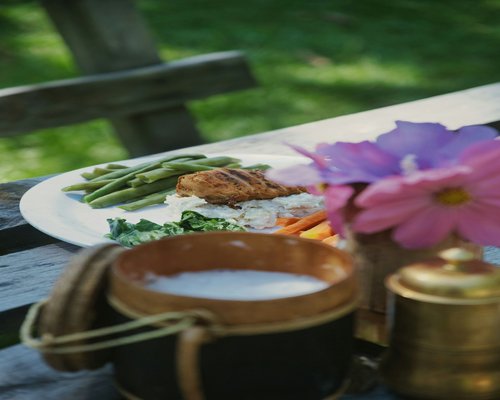 A healthy homemade meal prepared with fresh vegetables and rice on a dining table